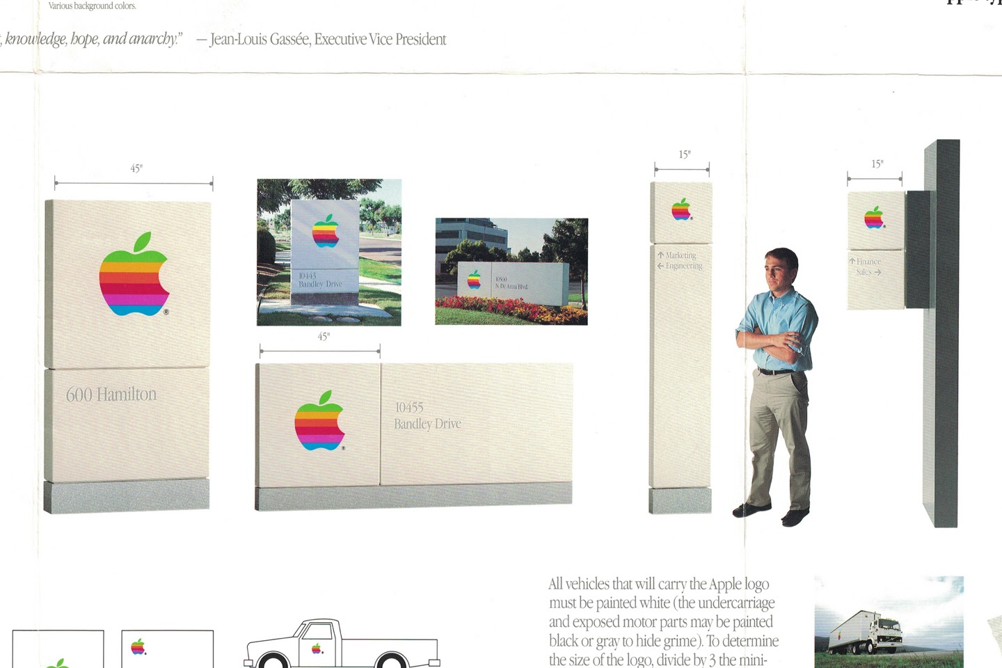 A visual identity system for the Apple logo featuring signage of various sizes. 