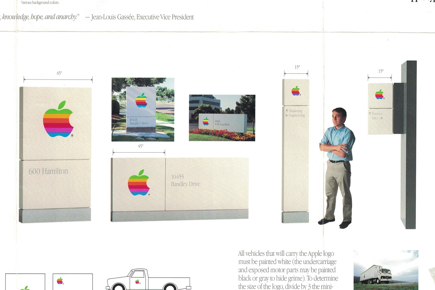 A visual identity system for the Apple logo featuring signage of various sizes.