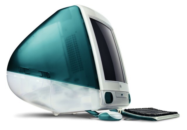 A teal Macintosh computer with a plastic shell.