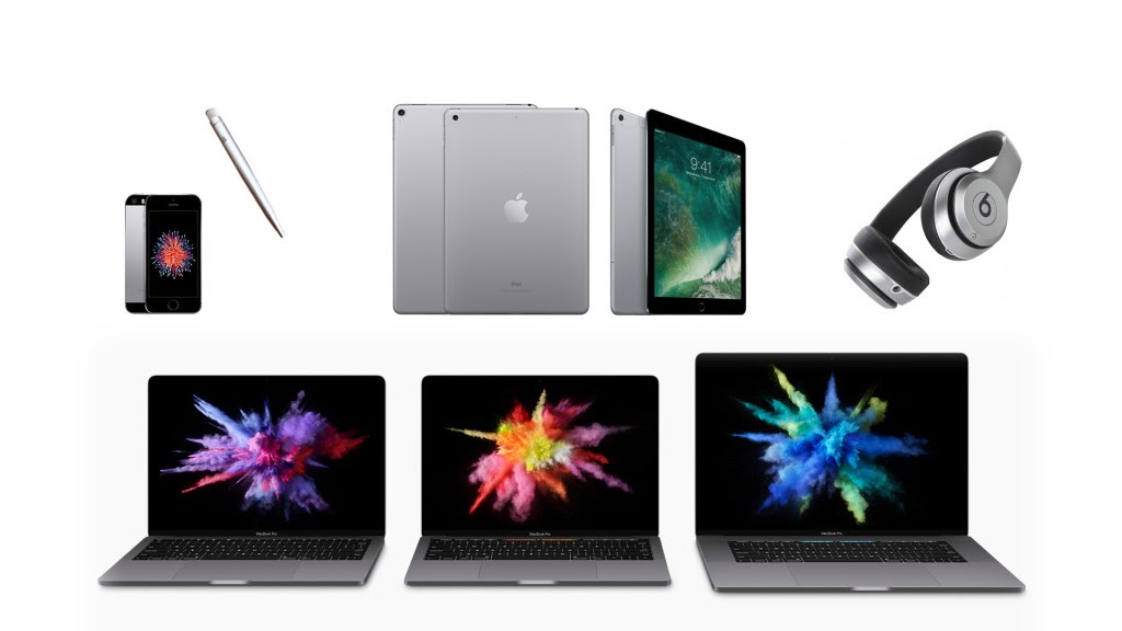 A collection of Apple devices, such as iPhones, iPads, Beats headphones, and Macbook Pro laptops.
